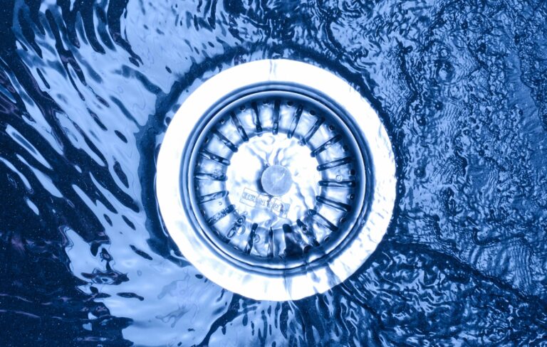 An image showing free flowing water after a drain has been unblocked